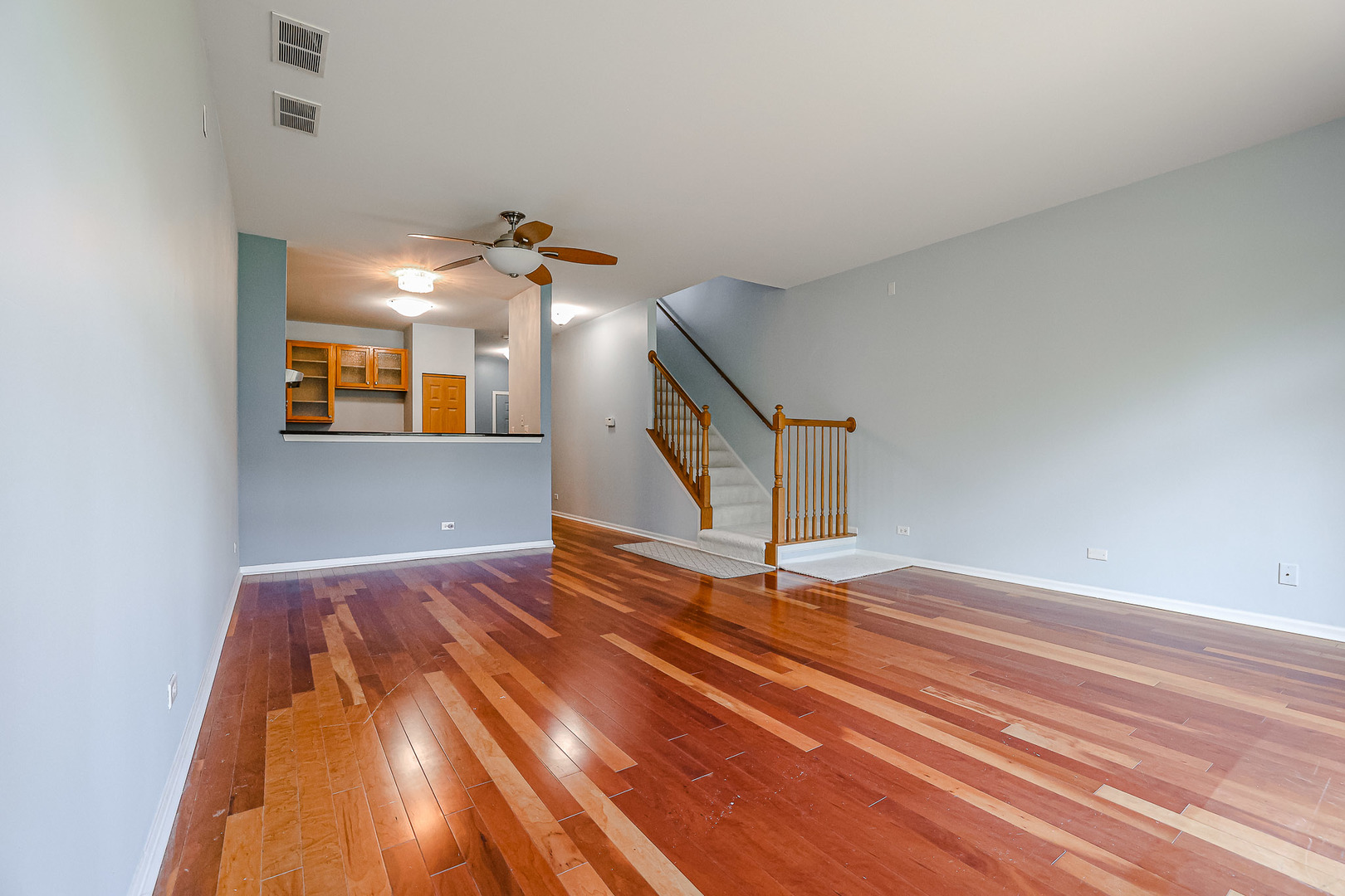2439 Oneida Lane Naperville, IL 60563 - Photo 12 of 25 a view of an empty room and wooden floor
