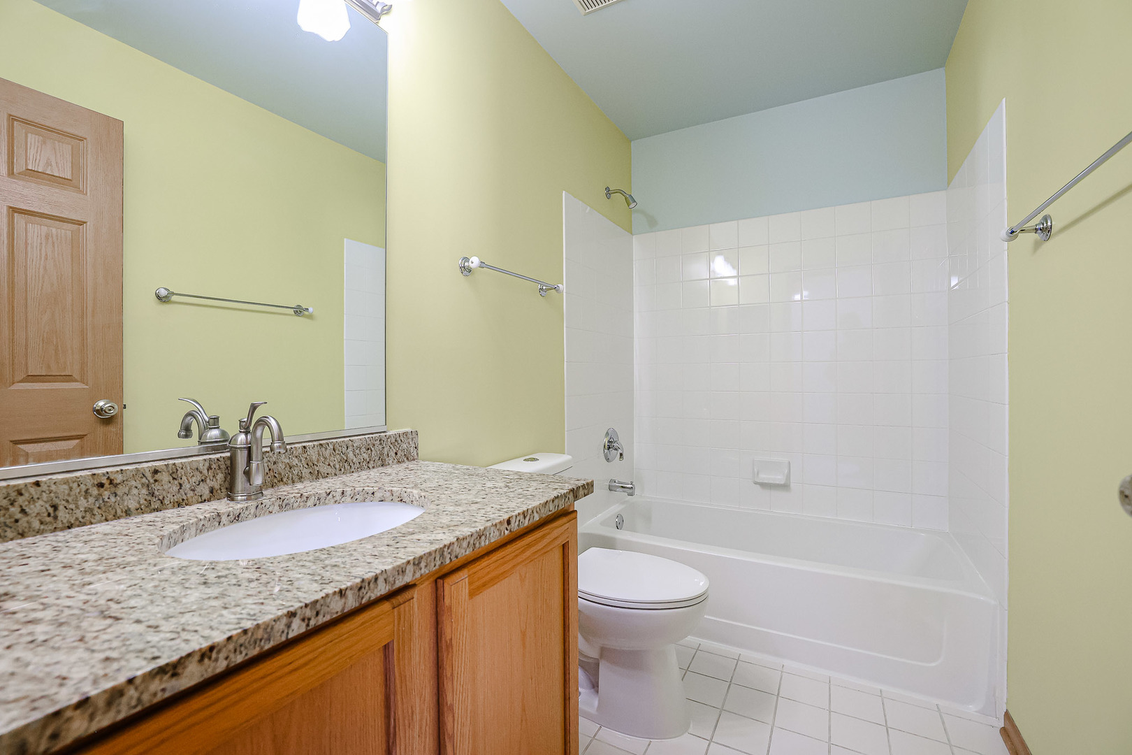 2439 Oneida Lane Naperville, IL 60563 - Photo 18 of 25 a bathroom with a granite countertop sink a toilet and shower