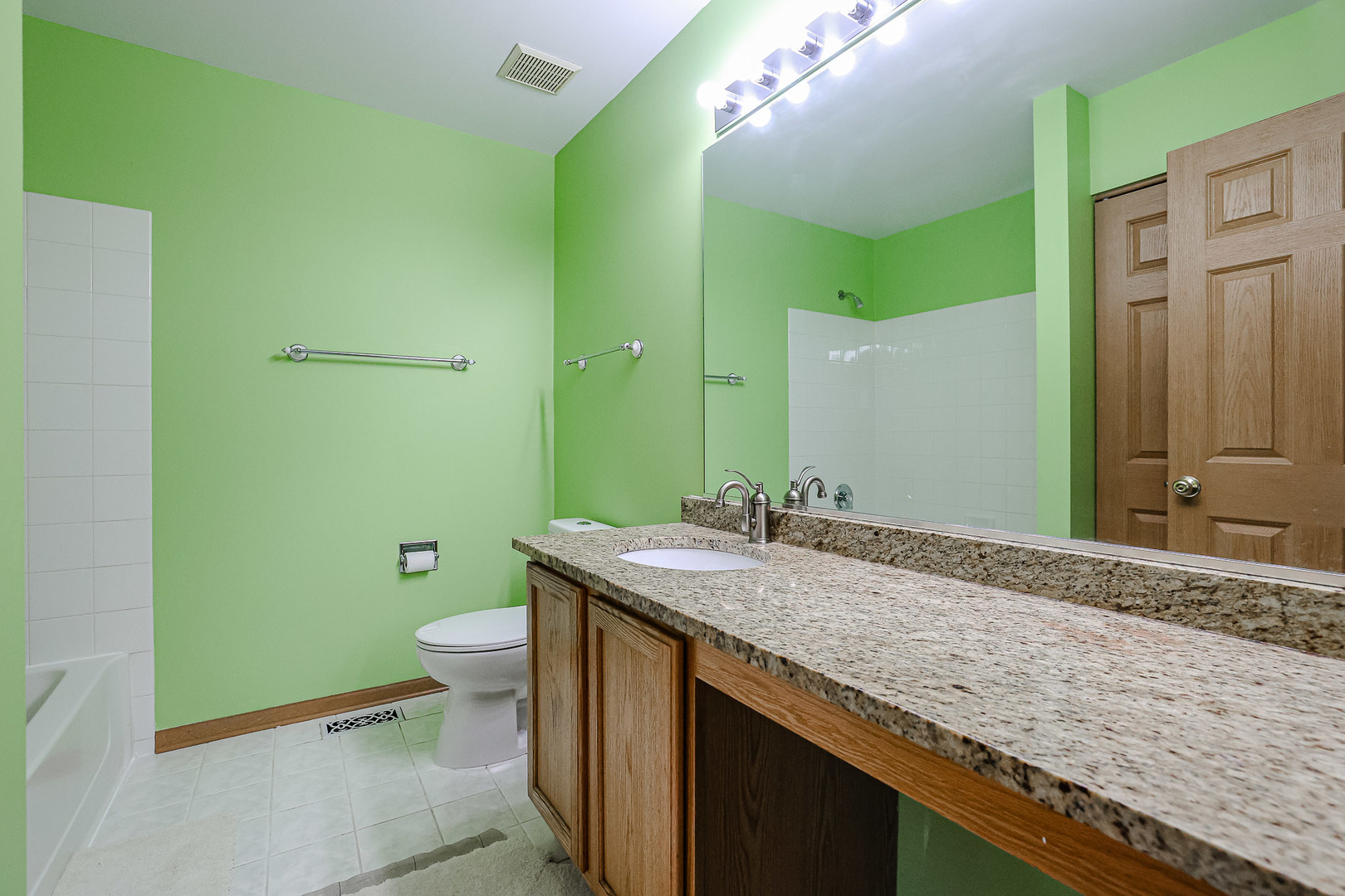 2439 Oneida Lane Naperville, IL 60563 - Photo 22 of 25 a bathroom with a granite countertop toilet sink and mirror