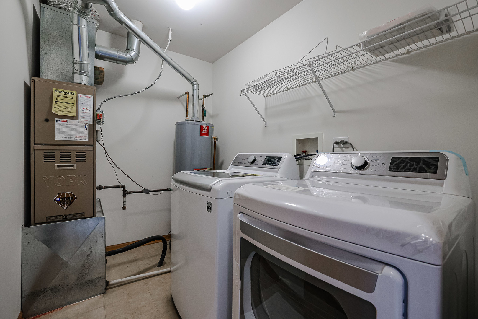 2439 Oneida Lane Naperville, IL 60563 - Photo 24 of 25 a utility room with dryer and washer