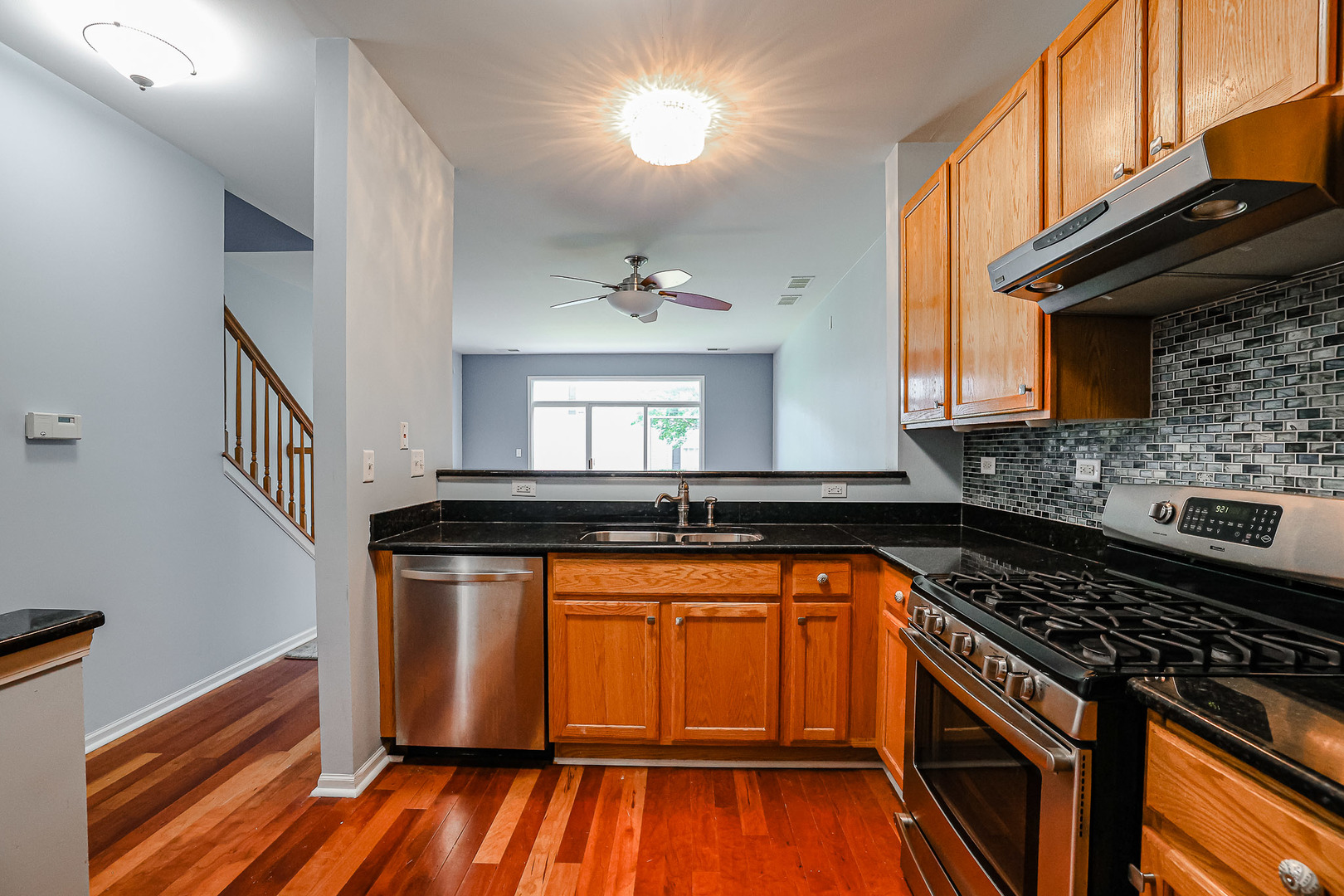 2439 Oneida Lane Naperville, IL 60563 - Photo 3 of 25 a kitchen with granite countertop a stove and a sink