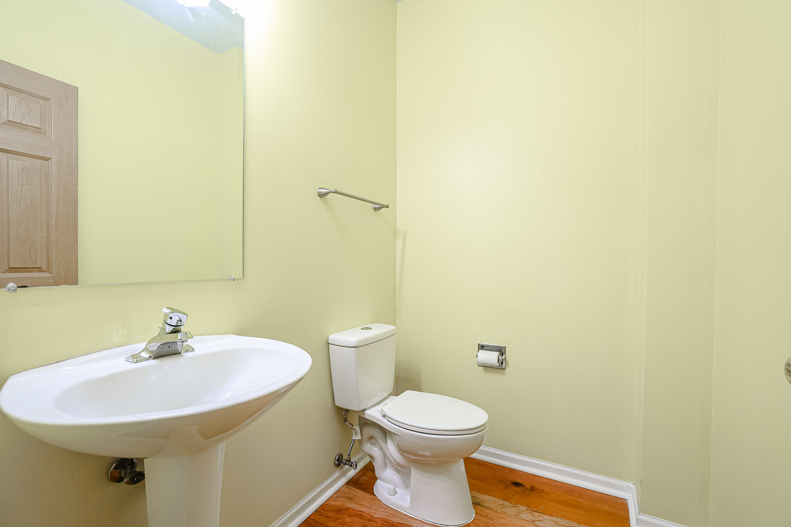 2439 Oneida Lane Naperville, IL 60563 - Photo 8 of 25 a bathroom with a sink a toilet and a mirror