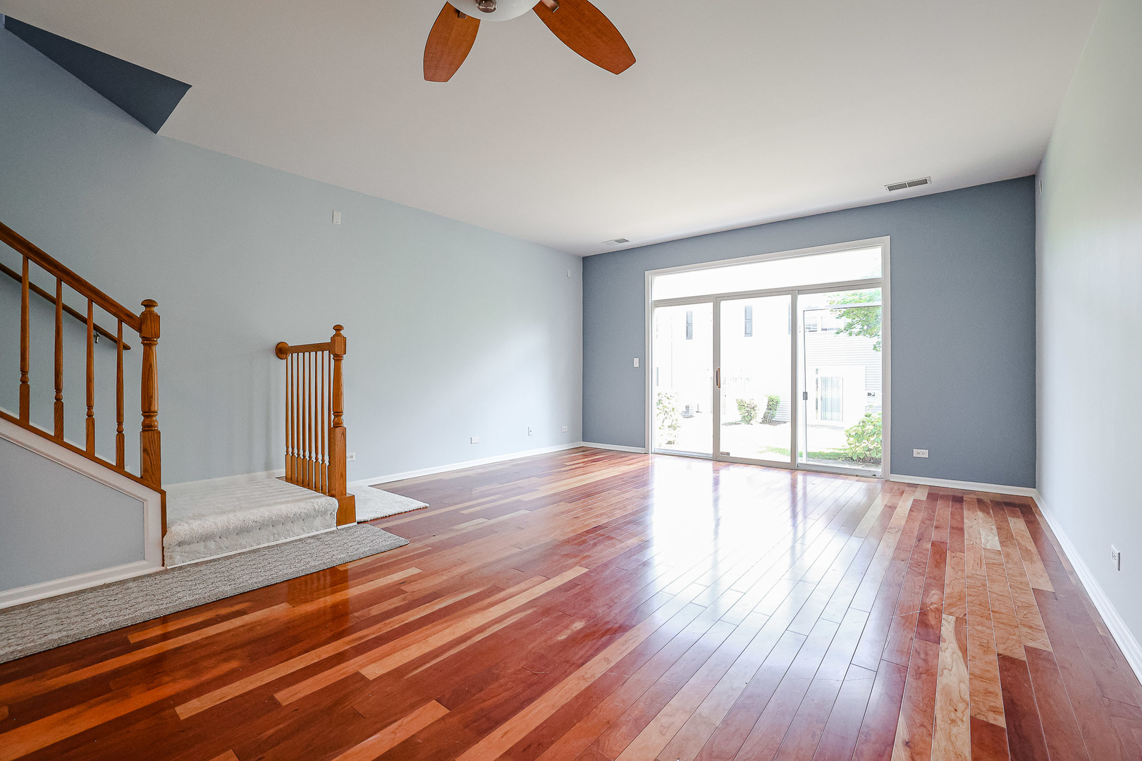2439 Oneida Lane Naperville, IL 60563 - Photo 10 of 25 a view of an empty room with wooden floor and window