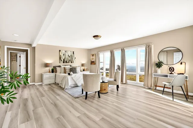 a bedroom with bed and a window