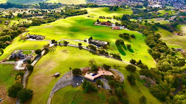 an aerial view of a house with a lake view