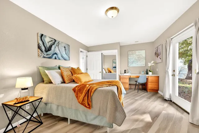 a bedroom with a large bed and a large window