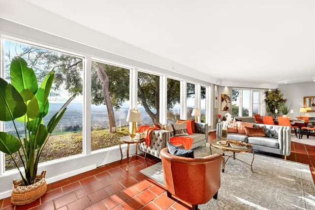 a view of an ocean yard and mountain view in back