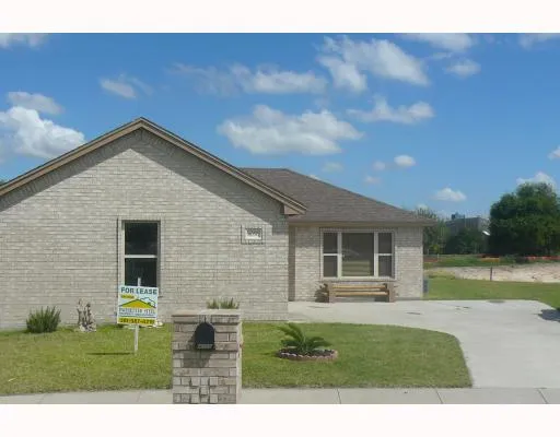 a house view with swimming pool and garden space