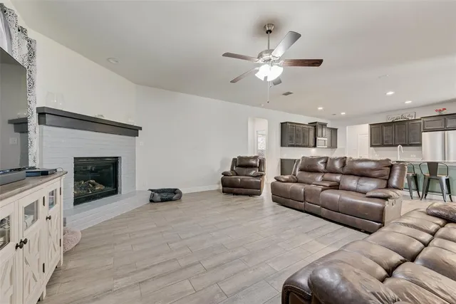 a living room with furniture and a fireplace