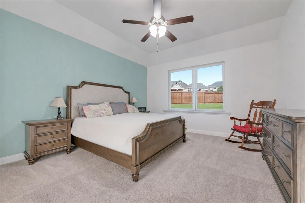 1279 Altuda Drive Forney, TX 75126 - Photo 19 of 35 a bedroom with a bed chair and a window