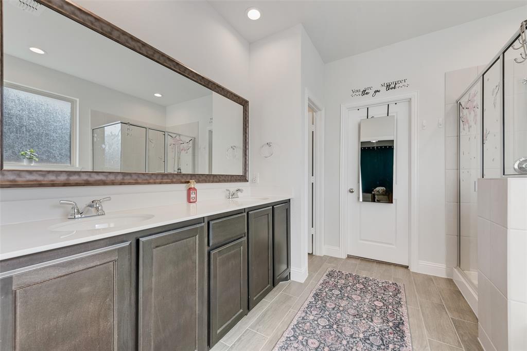 1279 Altuda Drive Forney, TX 75126 - Photo 21 of 35 a spacious bathroom with a double vanity sink and a mirror