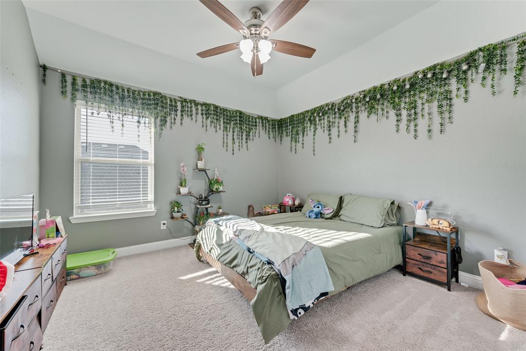 1279 Altuda Drive Forney, TX 75126 - Photo 26 of 35 a bedroom with a bed and a window