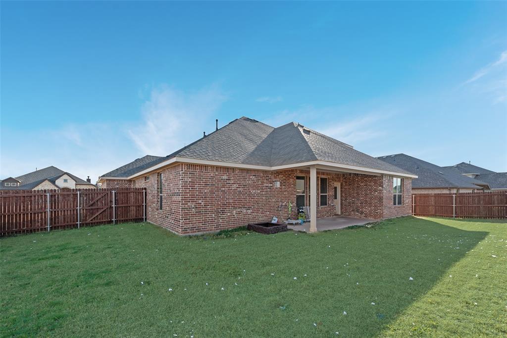 1279 Altuda Drive Forney, TX 75126 - Photo 28 of 35 a view of a house with a yard and large tree
