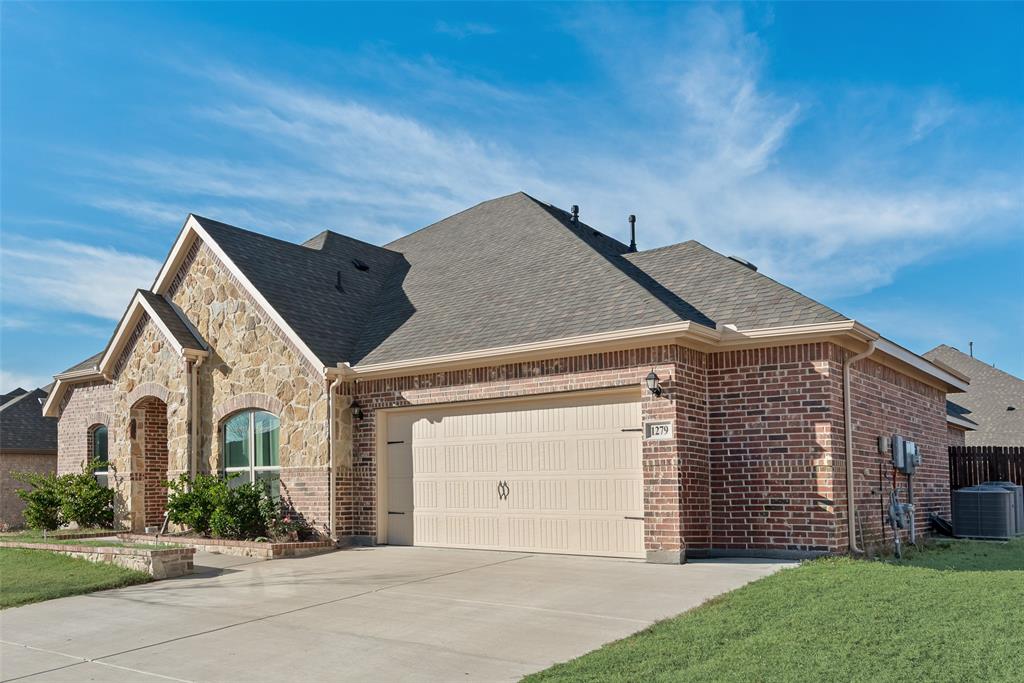 1279 Altuda Drive Forney, TX 75126 - Photo 30 of 35 front view of a house with a street