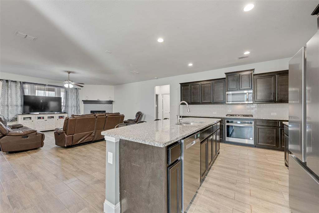 1279 Altuda Drive Forney, TX 75126 - Photo 7 of 35 a large kitchen with stainless steel appliances lots of counter top space