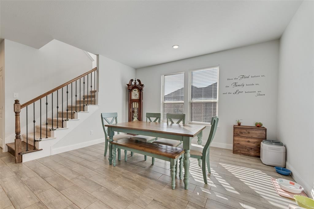 1279 Altuda Drive Forney, TX 75126 - Photo 8 of 35 a view of a dining room with furniture window and wooden floor
