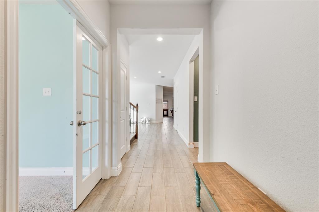 1279 Altuda Drive Forney, TX 75126 - Photo 9 of 35 a view of a hallway with wooden floor