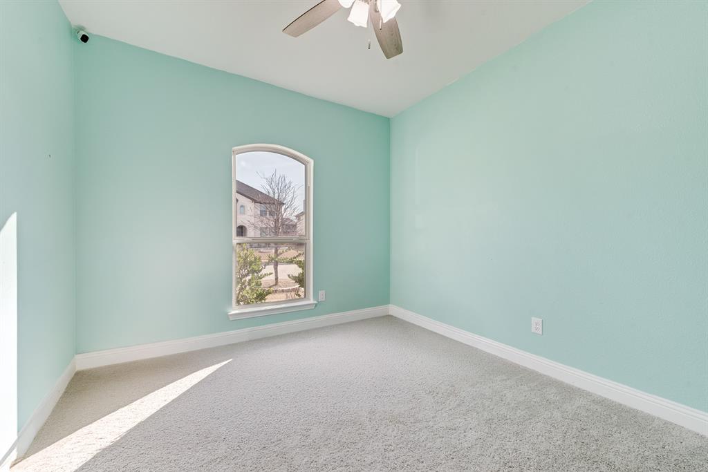 1279 Altuda Drive Forney, TX 75126 - Photo 10 of 35 an empty room with a window and a fan