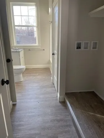 a bathroom with a toilet a sink and a bathtub