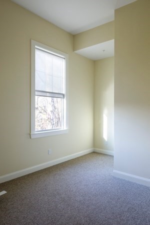 33 West Main Street, Unit A Groton, MA 01450 - Photo 8 of 10 an empty room with a window