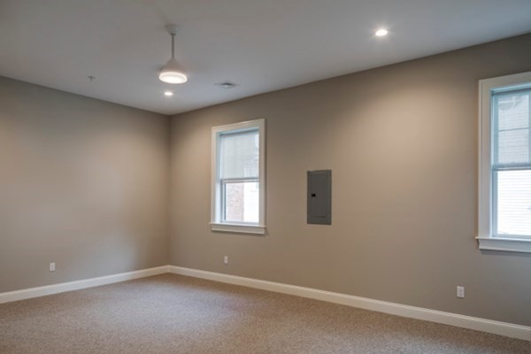 33 West Main Street, Unit A Groton, MA 01450 - Photo 9 of 10 an empty room with windows