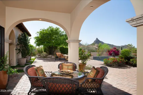 a view of a backyard with sitting area