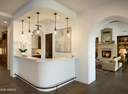 a view of a living room with a fireplace