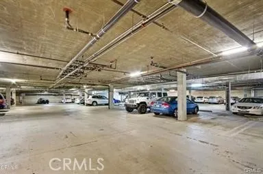 a view of parking garage with cars