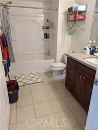 a kitchen with stainless steel appliances a sink a window and cabinets