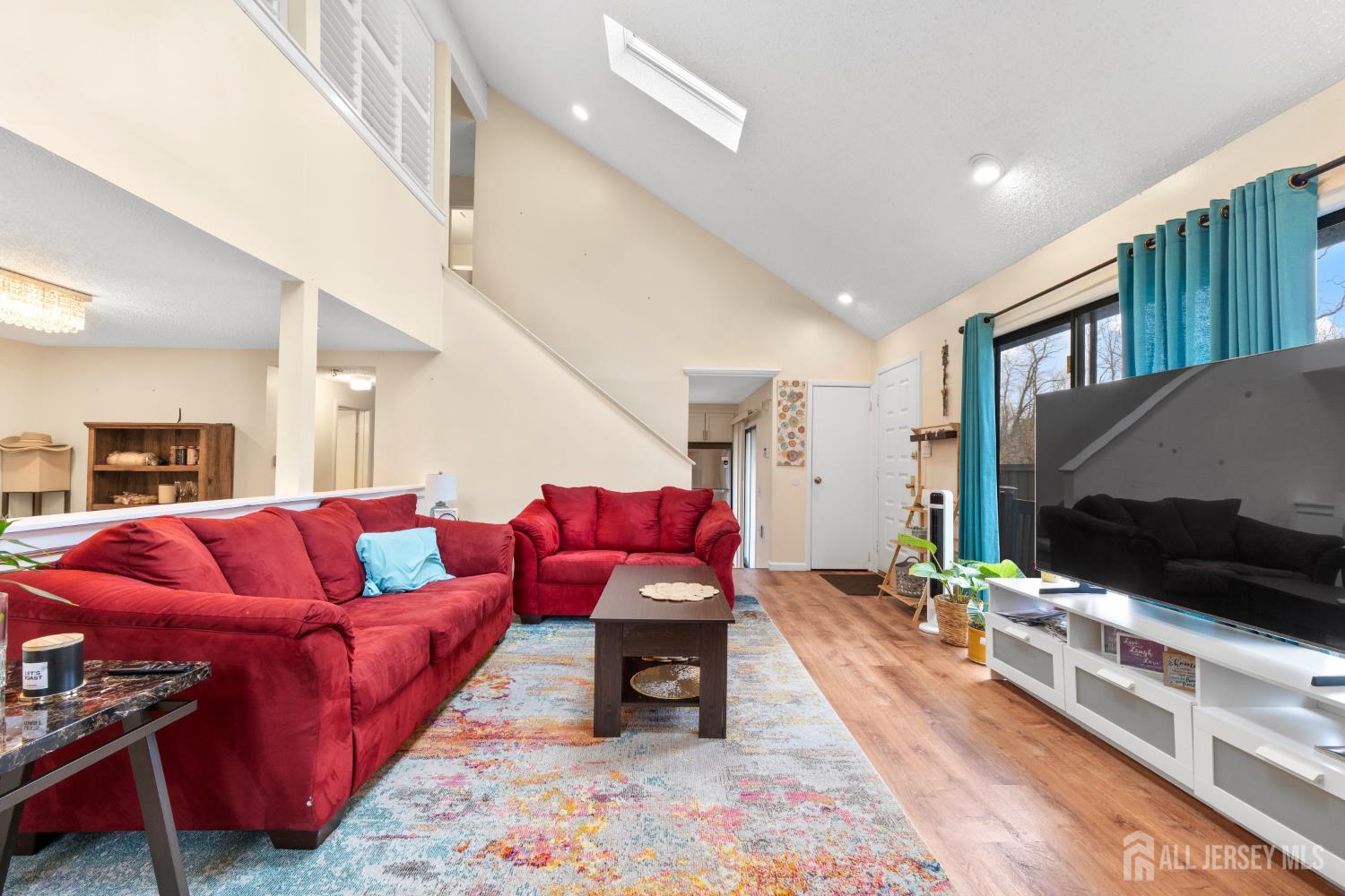 272 Westgate Drive Edison, NJ 08820 - Photo 13 of 47 a living room with furniture and a flat screen tv