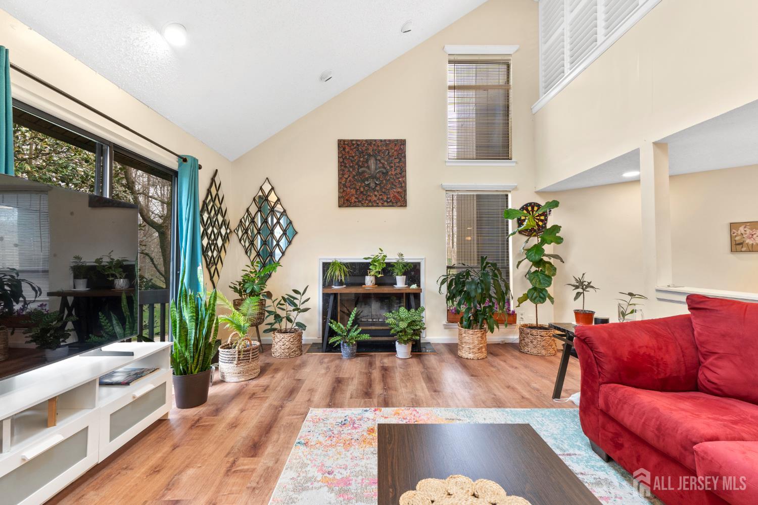 272 Westgate Drive Edison, NJ 08820 - Photo 15 of 47 a living room with furniture fireplace and potted plant