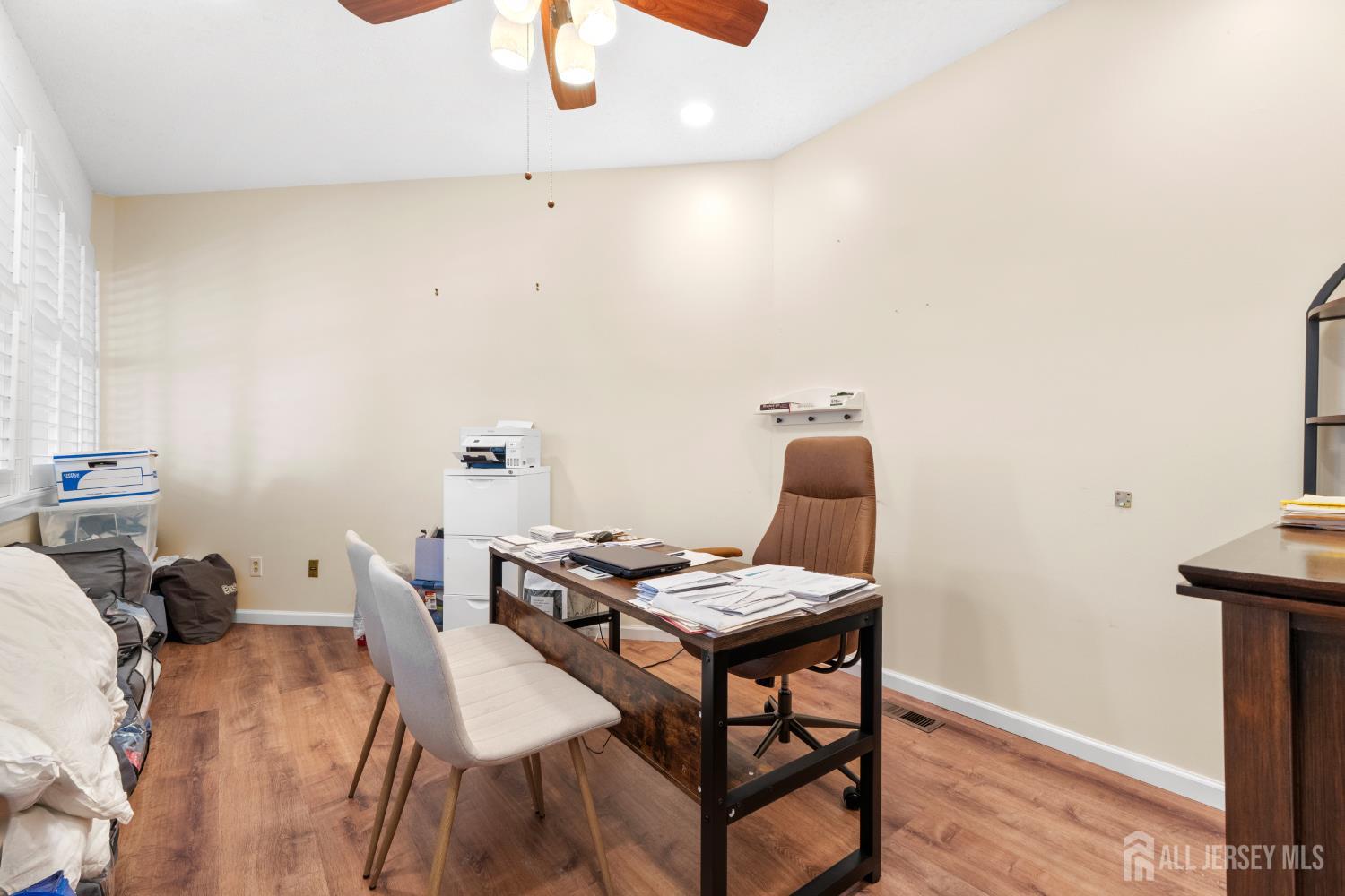272 Westgate Drive Edison, NJ 08820 - Photo 27 of 47 a workspace with furniture and wooden floor