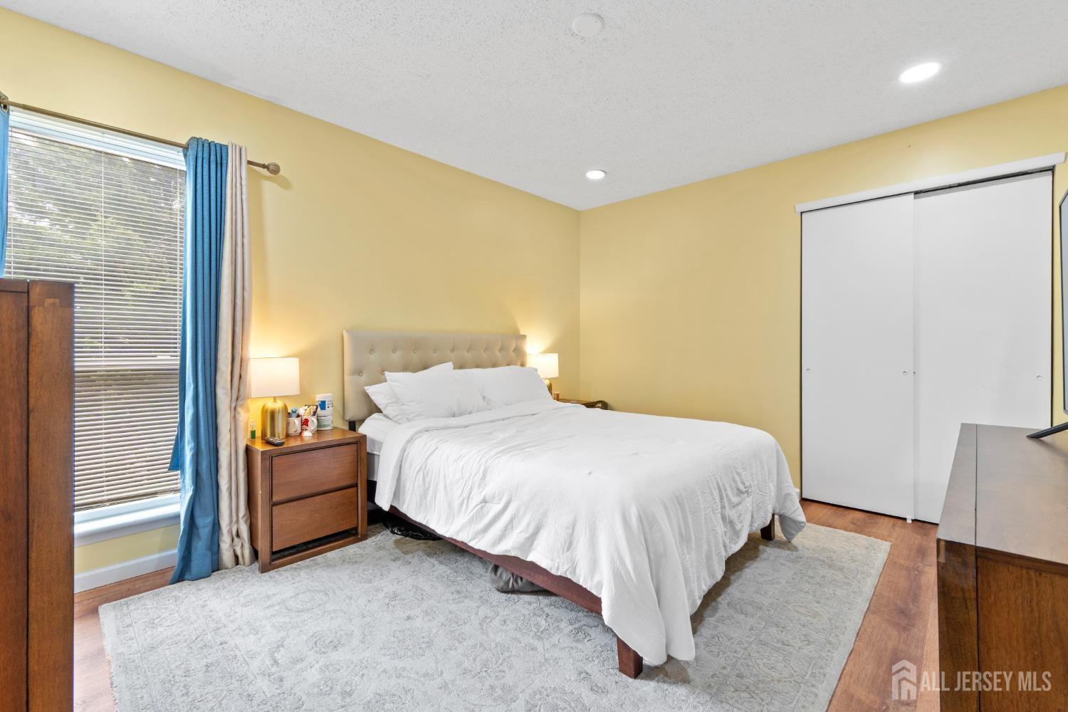272 Westgate Drive Edison, NJ 08820 - Photo 29 of 47 a bedroom with a bed and wooden floor