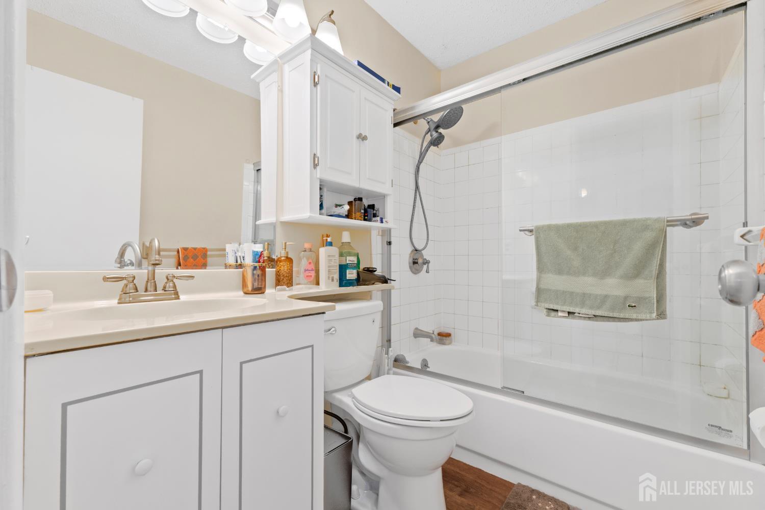272 Westgate Drive Edison, NJ 08820 - Photo 31 of 47 a bathroom with a sink a toilet and shower