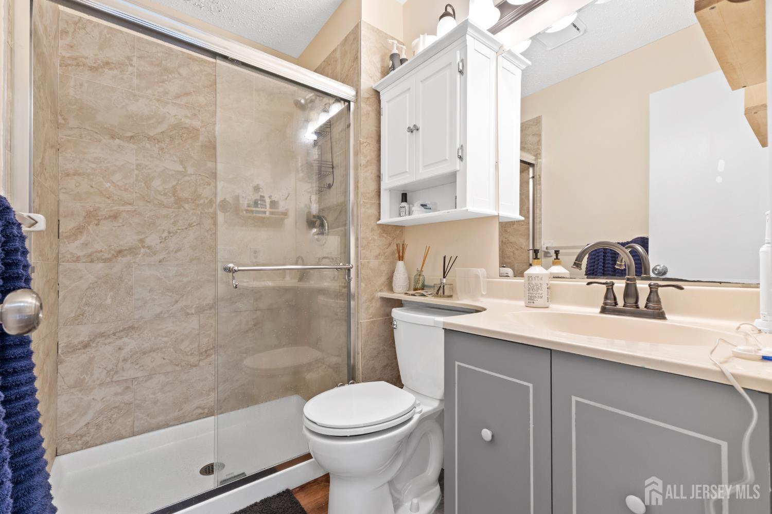 272 Westgate Drive Edison, NJ 08820 - Photo 36 of 47 a bathroom with a sink toilet and shower