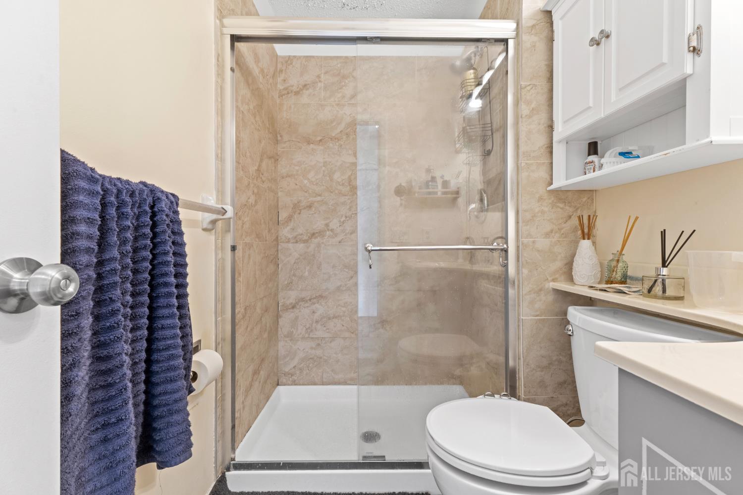 272 Westgate Drive Edison, NJ 08820 - Photo 37 of 47 a bathroom with a toilet and a shower