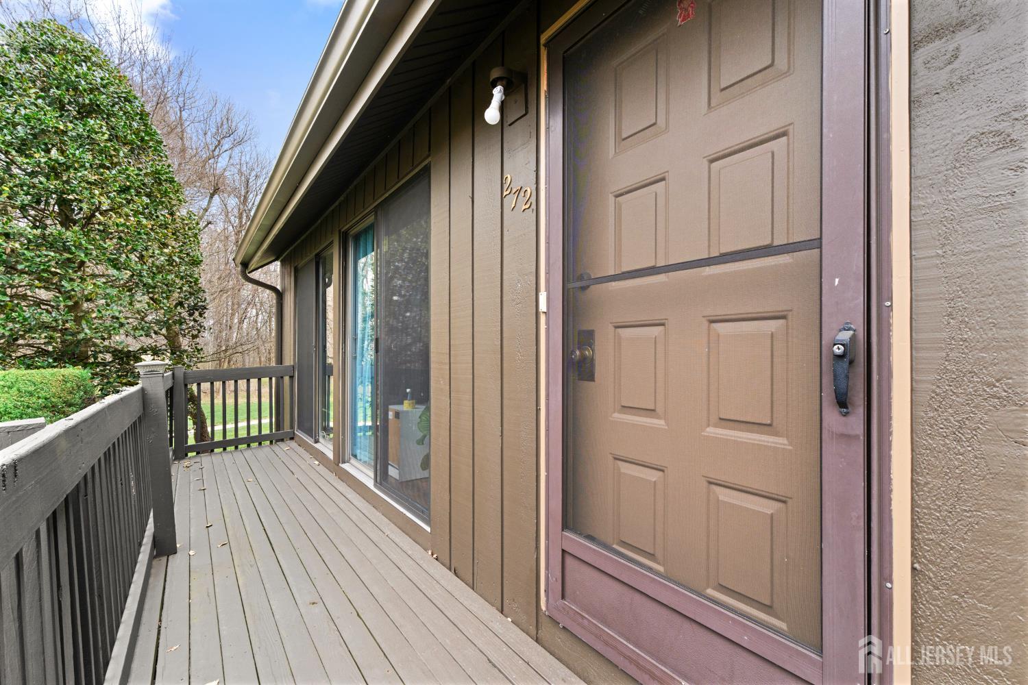 272 Westgate Drive Edison, NJ 08820 - Photo 8 of 47 a view of a house with a wooden deck