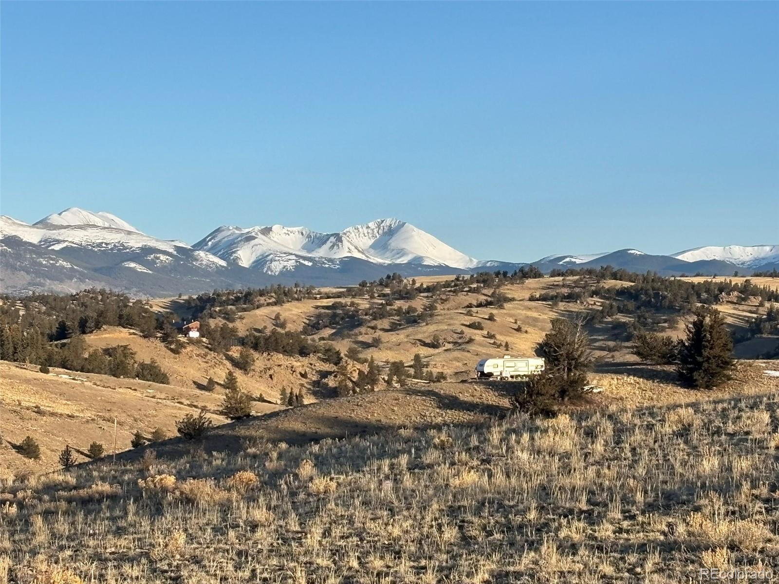 1290 Lippzana Road Como, CO 80456 - Photo 3 of 18 a view of a large building with mountains in the background