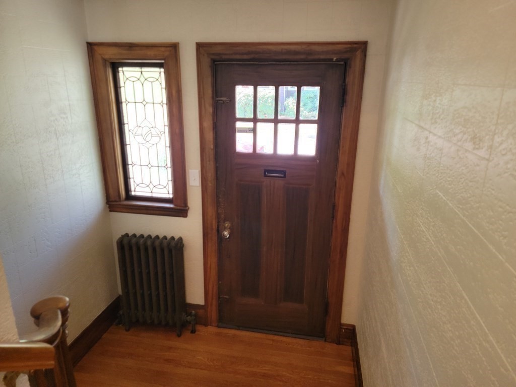 133 Fairview Avenue, Unit 133 Belmont, MA 02478 - Photo 12 of 33 a view of front door with chair