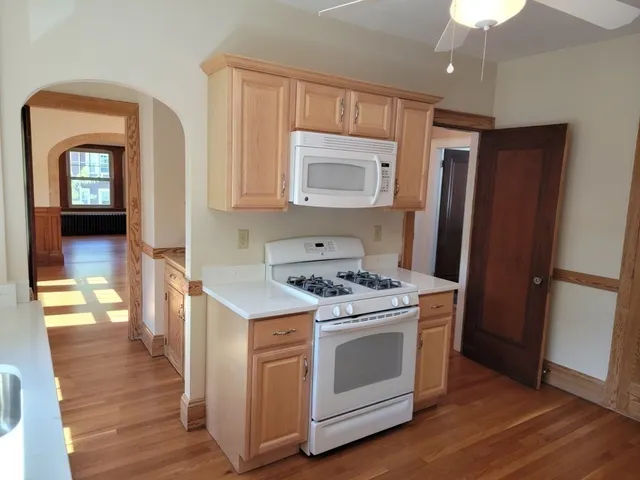 a kitchen with a stove and a refrigerator