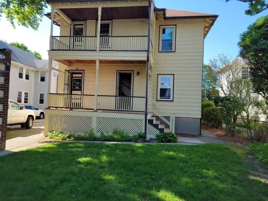 133 Fairview Avenue, Unit 133 Belmont, MA 02478 - Photo 26 of 33 a view of a house with a yard