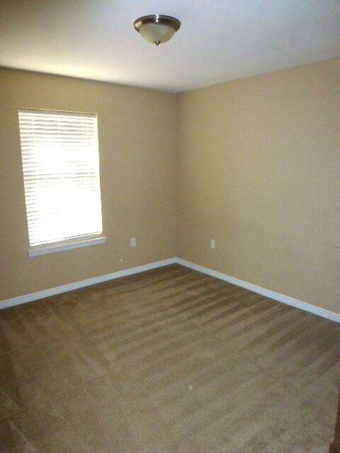 2829 Shoni Drive Navarre, FL 32566 - Photo 24 of 33 an empty room with a workbench