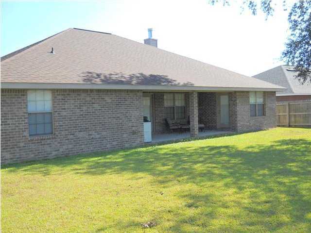 2829 Shoni Drive Navarre, FL 32566 - Photo 31 of 33 a view of a house with a backyard