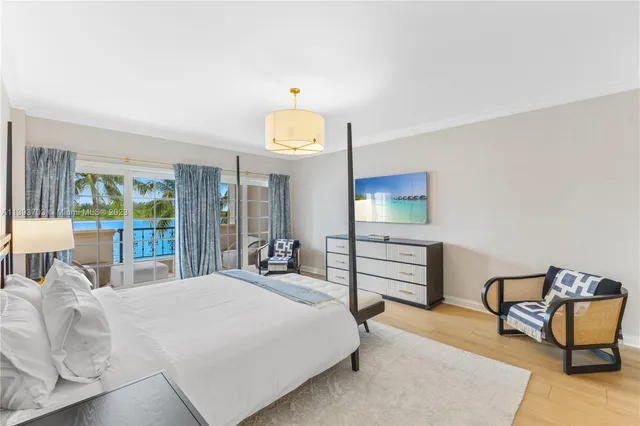 a bedroom with a bed and a chair