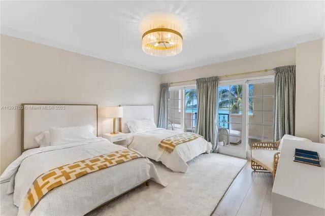 a bedroom with double bed and a large window