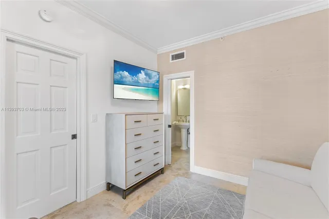 a view of room with cabinet and wall