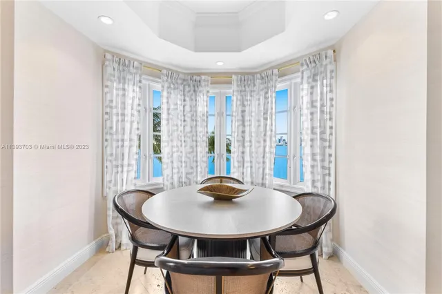 a view of a dining room with furniture and window