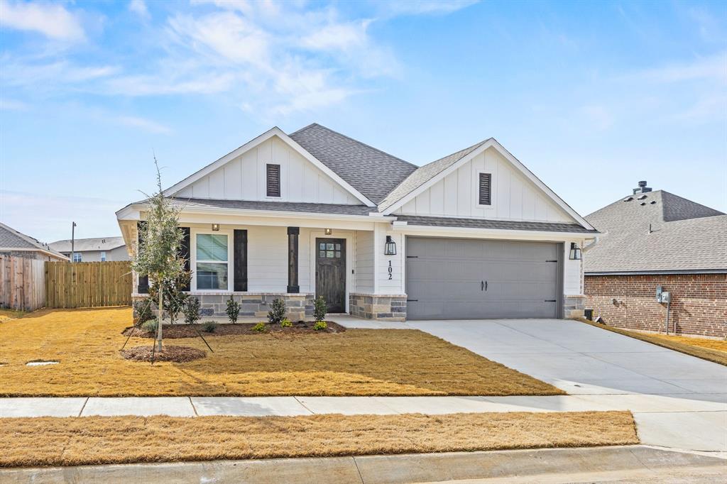 102 Maverick Trail Valley View, TX 76272 - Photo 2 of 32 a front view of a house with a yard