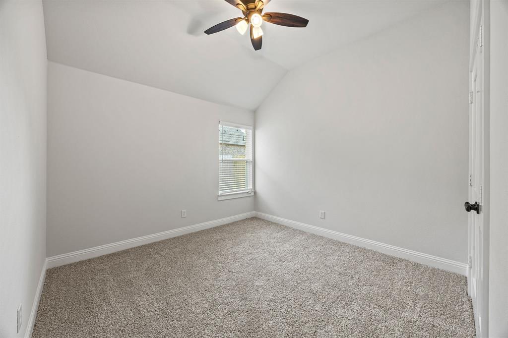 102 Maverick Trail Valley View, TX 76272 - Photo 21 of 32 an empty room with a window and a fan