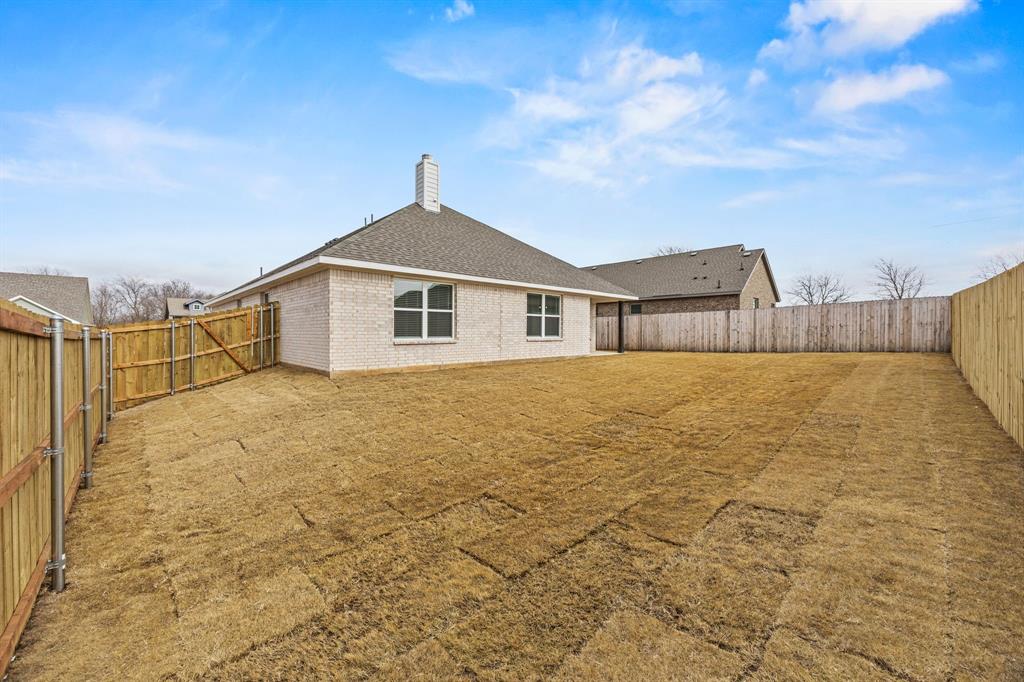 102 Maverick Trail Valley View, TX 76272 - Photo 28 of 32 a view of a house with a yard